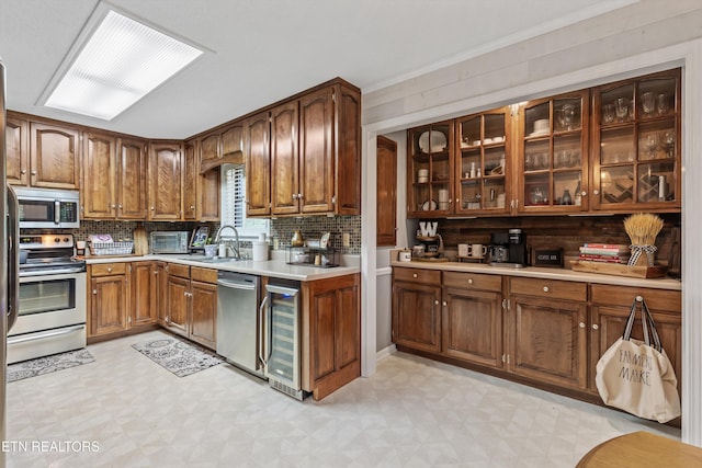 1420 Brentwood Dr, Athens, TN 37303 - kitchen featuring appliances with stainless steel finishes, wine cooler, light flooring, a sink, and backsplash