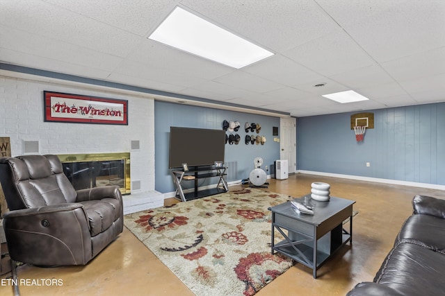 1420 Brentwood Dr, Athens, TN 37303 - living area with finished concrete floors, a drop ceiling, baseboards, and a fireplace