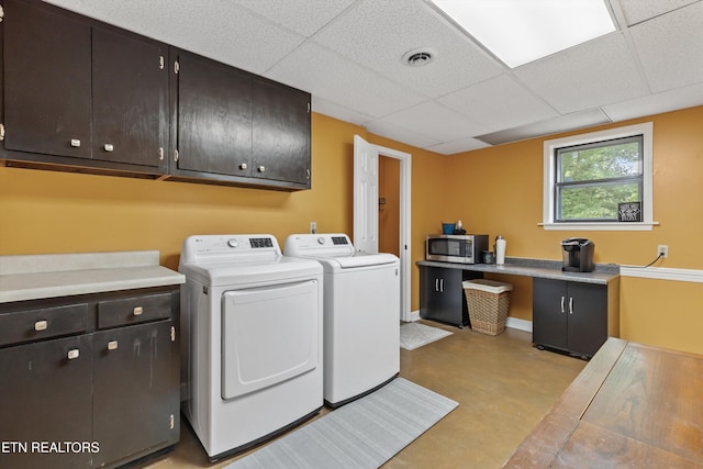 1420 Brentwood Dr, Athens, TN 37303 - laundry area with cabinet space, washing machine and clothes dryer, and baseboards