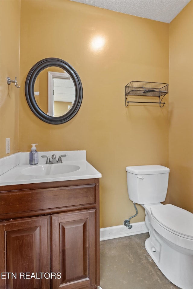 1420 Brentwood Dr, Athens, TN 37303 - bathroom with toilet, vanity, baseboards, and concrete flooring