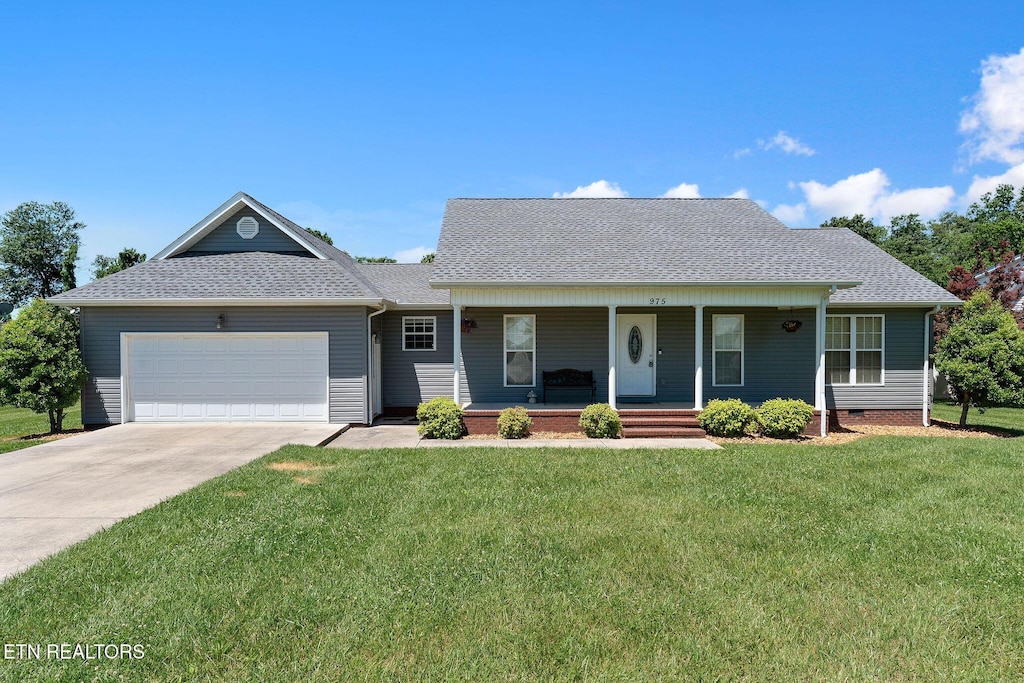 975 Eagle Landing Dr, Cookeville, TN 38506 - view of front of home featuring a garage, a porch, a front yard, concrete driveway, and a shingled roof