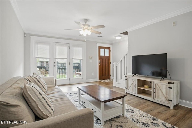 3950 Cherokee Woods Way Unit 204, Knoxville, TN 37920 - living room featuring ceiling fan, crown molding, wood finished floors, stairs, and baseboards