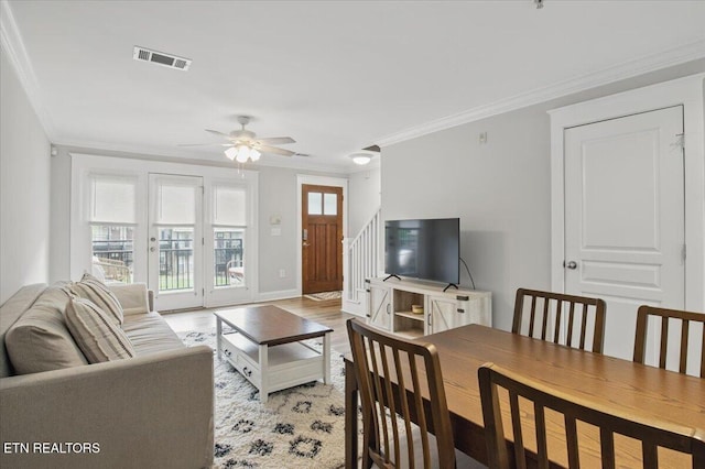 3950 Cherokee Woods Way Unit 204, Knoxville, TN 37920 - living area featuring ornamental molding, ceiling fan, light wood finished floors, and stairway