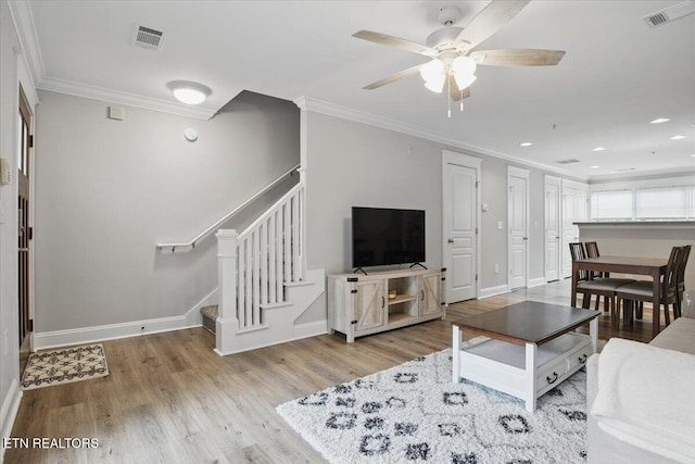 3950 Cherokee Woods Way Unit 204, Knoxville, TN 37920 - living area with stairway, crown molding, baseboards, wood finished floors, and a ceiling fan