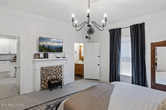 525 S Carter School Rd, Strawberry Plains, TN 37871 - bedroom featuring a chandelier, a fireplace, and ensuite bathroom