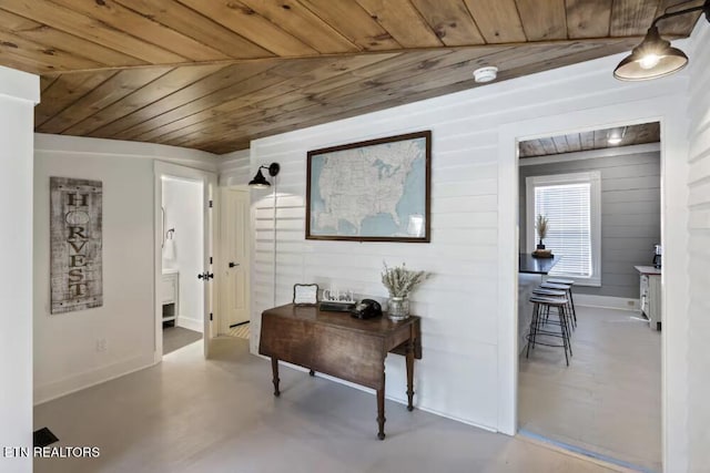 525 S Carter School Rd, Strawberry Plains, TN 37871 - hall with wood ceiling, concrete floors, wood walls, and baseboards