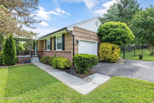 2116 Pleasant View Rd, Knoxville, TN 37914 - view of front of property with driveway, brick siding, a garage, and a porch