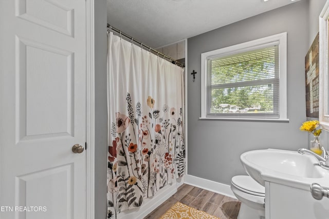 2116 Pleasant View Rd, Knoxville, TN 37914 - bathroom with vanity, toilet, wood finished floors, baseboards, and a shower with shower curtain