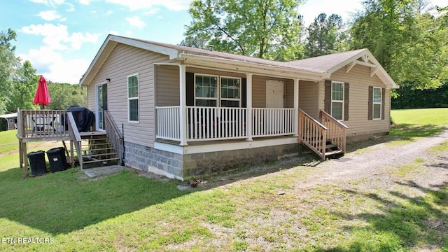 516 Lakewood Dr, Decatur, TN 37322 - view of front of house with crawl space, a porch, stairway, and a front lawn