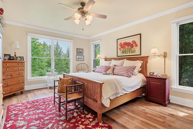 670 Hawk View Dr, Townsend, TN 37882 - bedroom featuring light wood finished floors, baseboards, crown molding, and a ceiling fan
