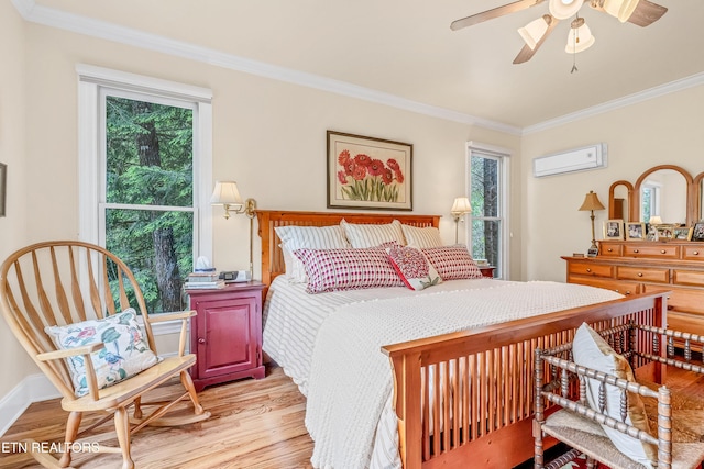 670 Hawk View Dr, Townsend, TN 37882 - bedroom with crown molding, light wood-type flooring, a wall mounted AC, and a ceiling fan
