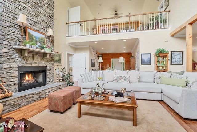 670 Hawk View Dr, Townsend, TN 37882 - living area with a high ceiling, a fireplace, a ceiling fan, and wood finished floors