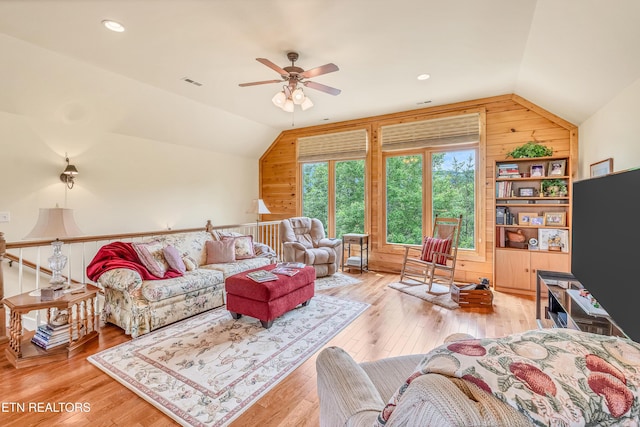 670 Hawk View Dr, Townsend, TN 37882 - living room featuring lofted ceiling, wood walls, a ceiling fan, and hardwood / wood-style flooring