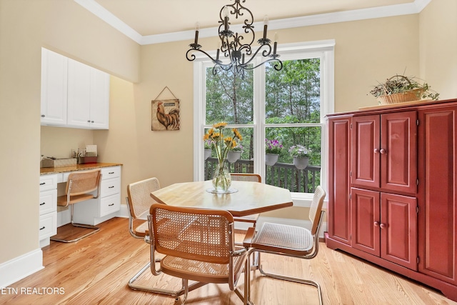 670 Hawk View Dr, Townsend, TN 37882 - dining area featuring a chandelier, crown molding, and light wood-type flooring