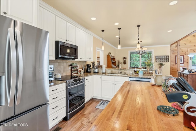 670 Hawk View Dr, Townsend, TN 37882 - kitchen featuring stainless steel appliances, wooden counters, a sink, ornamental molding, and tasteful backsplash