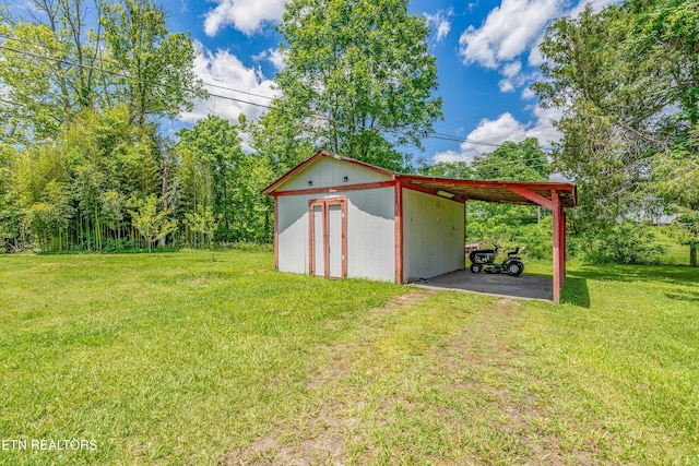 159 Little Creek Ln, Lafollette, TN 37766 - view of grassy yard with an outbuilding, driveway, and a carport