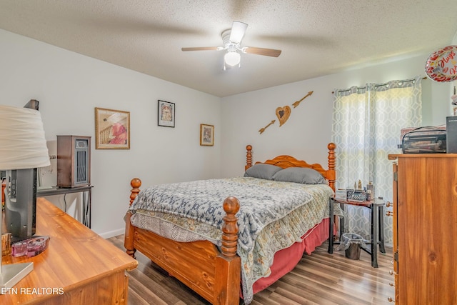 159 Little Creek Ln, Lafollette, TN 37766 - bedroom featuring wood finished floors, a ceiling fan, and a textured ceiling