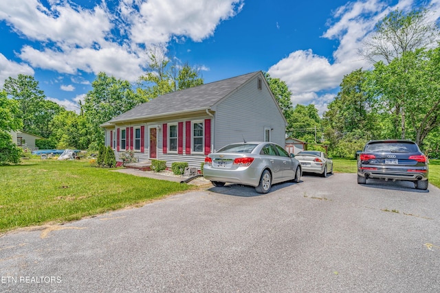 159 Little Creek Ln, Lafollette, TN 37766 - view of front facade with a front yard, a shingled roof, and driveway