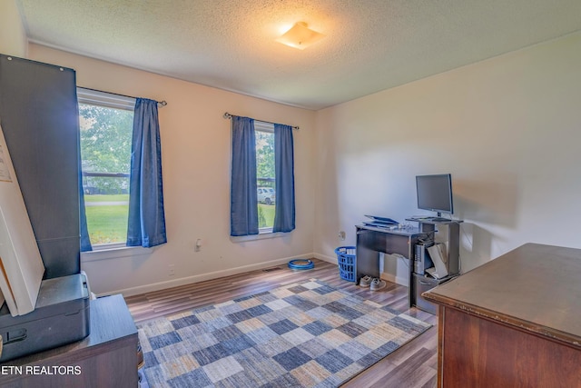 159 Little Creek Ln, Lafollette, TN 37766 - office area featuring wood finished floors, a textured ceiling, and baseboards