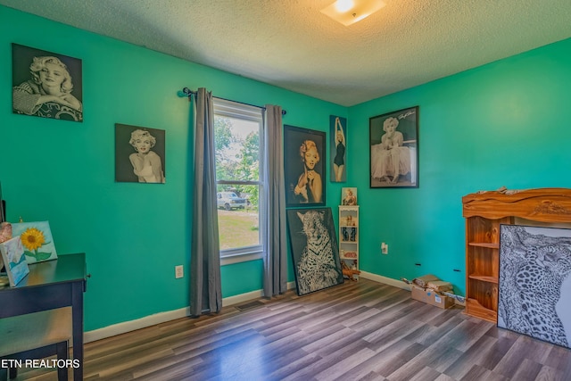 159 Little Creek Ln, Lafollette, TN 37766 - bedroom featuring wood finished floors, a textured ceiling, and baseboards