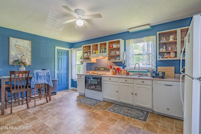 159 Little Creek Ln, Lafollette, TN 37766 - kitchen featuring white appliances, open shelves, a textured ceiling, a sink, and white cabinetry