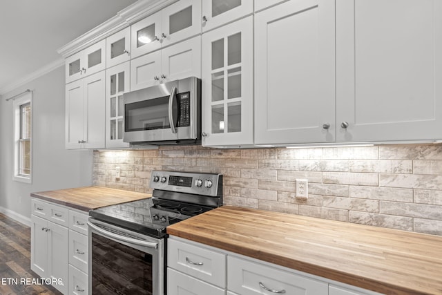 115 Tsuhdatsi Way, Loudon, TN 37774 - kitchen with butcher block countertops, stainless steel appliances, crown molding, baseboards, and dark wood-style flooring