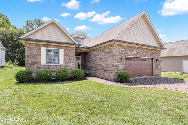 115 Tsuhdatsi Way, Loudon, TN 37774 - craftsman-style house with a garage, stone siding, a front yard, and decorative driveway