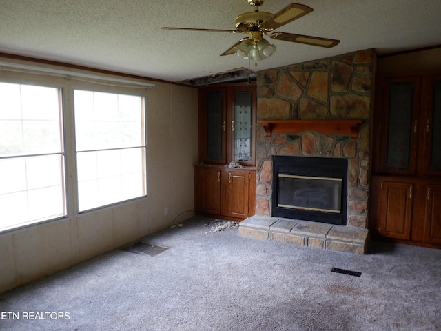 418 N Norris St, Jamestown, TN 38556 - unfurnished living room featuring carpet, a ceiling fan, a fireplace, a textured ceiling, and lofted ceiling