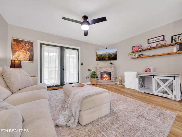 633 Vose Rd Unit G, Alcoa, TN 37701 - living room with wood finished floors, ceiling fan, a stone fireplace, and french doors