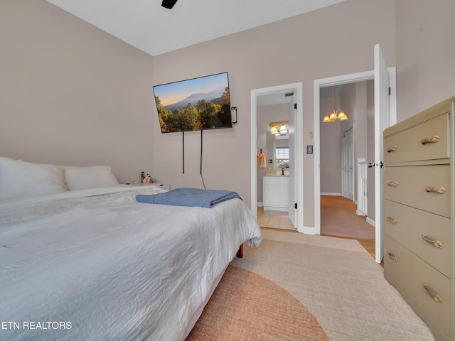 633 Vose Rd Unit G, Alcoa, TN 37701 - bedroom with carpet, a chandelier, ensuite bathroom, baseboards, and ceiling fan
