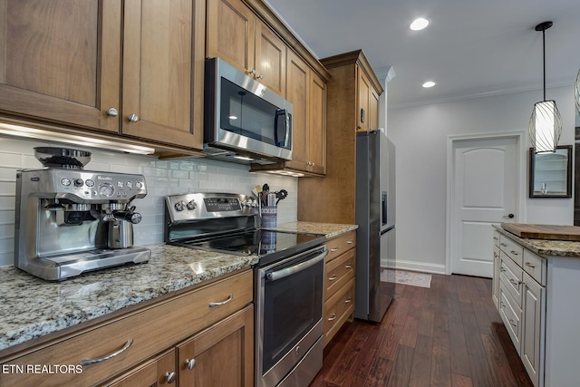 220 Tommotley Dr, Loudon, TN 37774 - kitchen with stainless steel appliances, brown cabinets, tasteful backsplash, light stone counters, and dark wood-style floors