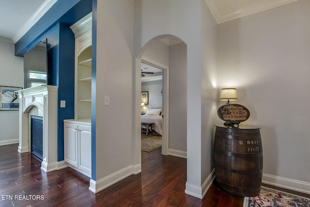 220 Tommotley Dr, Loudon, TN 37774 - hallway featuring ornamental molding, dark wood finished floors, arched walkways, and baseboards