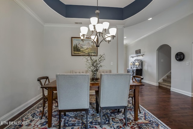 220 Tommotley Dr, Loudon, TN 37774 - dining area with wood finished floors, a chandelier, arched walkways, baseboards, and stairs