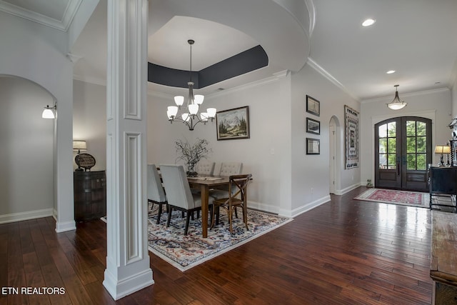 220 Tommotley Dr, Loudon, TN 37774 - dining area with arched walkways, hardwood / wood-style flooring, ornate columns, baseboards, and ornamental molding