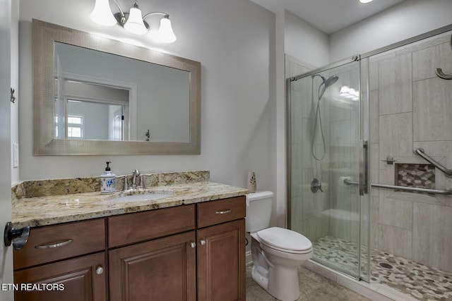 220 Tommotley Dr, Loudon, TN 37774 - full bathroom featuring vanity, toilet, a stall shower, a chandelier, and tile patterned floors