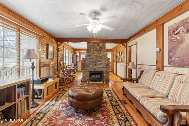 2009 Tellico Reliance Rd, Reliance, TN 37369 - living room featuring wood finished floors, ceiling fan, wood walls, and wood ceiling with exposed beams