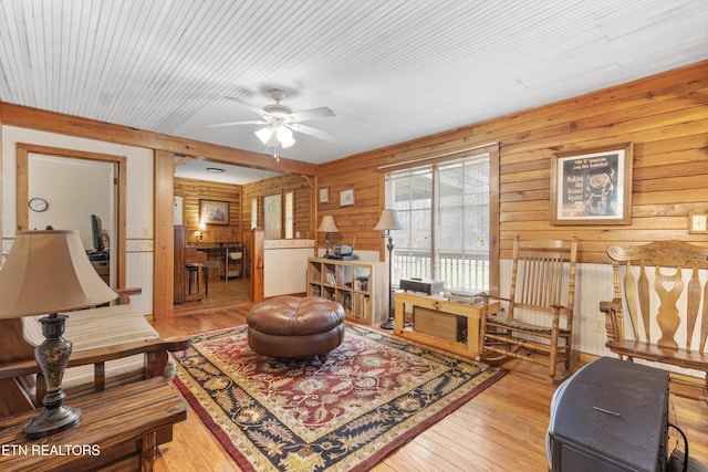 2009 Tellico Reliance Rd, Reliance, TN 37369 - living area featuring wood walls, hardwood / wood-style flooring, and a ceiling fan