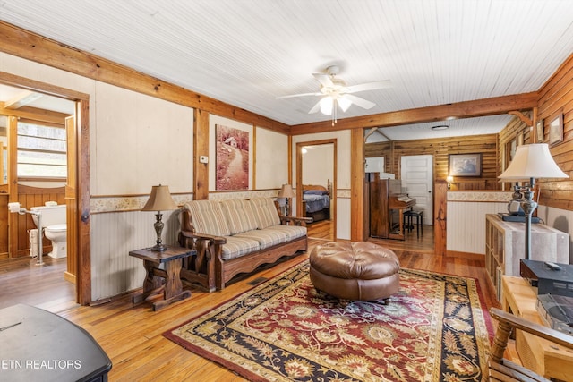2009 Tellico Reliance Rd, Reliance, TN 37369 - living area featuring wooden walls, wood finished floors, and ceiling fan