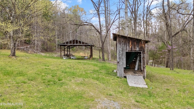 2009 Tellico Reliance Rd, Reliance, TN 37369 - view of green lawn with a detached carport