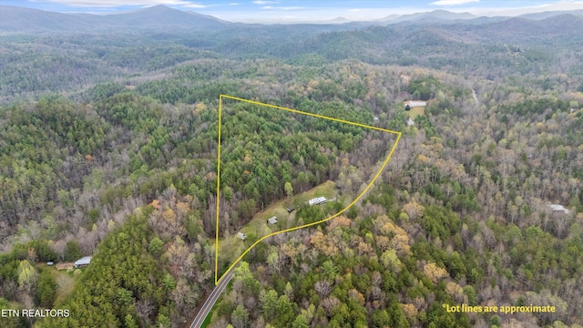 2009 Tellico Reliance Rd, Reliance, TN 37369 - aerial view of property's location featuring a heavily wooded area, a mountainous background, and property parcel outlined
