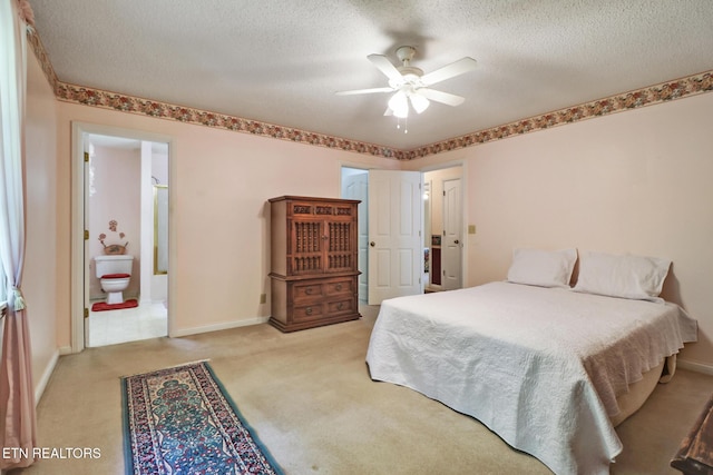 2162 Spruce Loop, Crossville, TN 38555 - bedroom with carpet flooring, a textured ceiling, baseboards, connected bathroom, and a ceiling fan