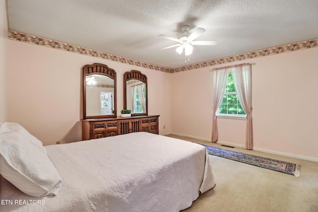 2162 Spruce Loop, Crossville, TN 38555 - carpeted bedroom with a textured ceiling, a ceiling fan, and baseboards