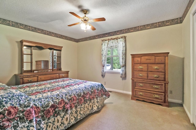 2162 Spruce Loop, Crossville, TN 38555 - bedroom featuring baseboards, light colored carpet, a textured ceiling, and a ceiling fan