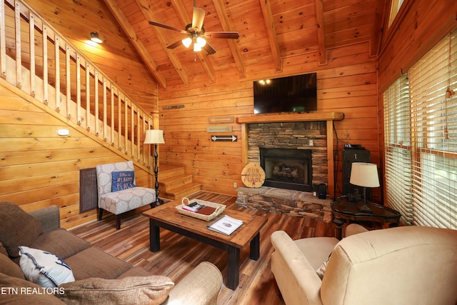 556 Wildwood Forest Way, Sevierville, TN 37876 - living room featuring wood finished floors, wood ceiling, stairs, wood walls, and ceiling fan