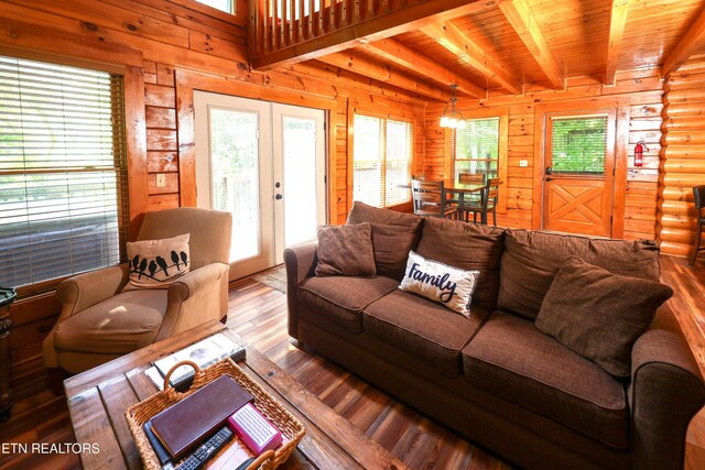 556 Wildwood Forest Way, Sevierville, TN 37876 - living area with hardwood / wood-style floors, plenty of natural light, french doors, wooden walls, and wooden ceiling with exposed beams