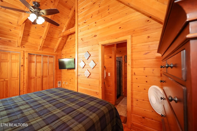 556 Wildwood Forest Way, Sevierville, TN 37876 - bedroom with wood walls, wooden ceiling, and carpet floors