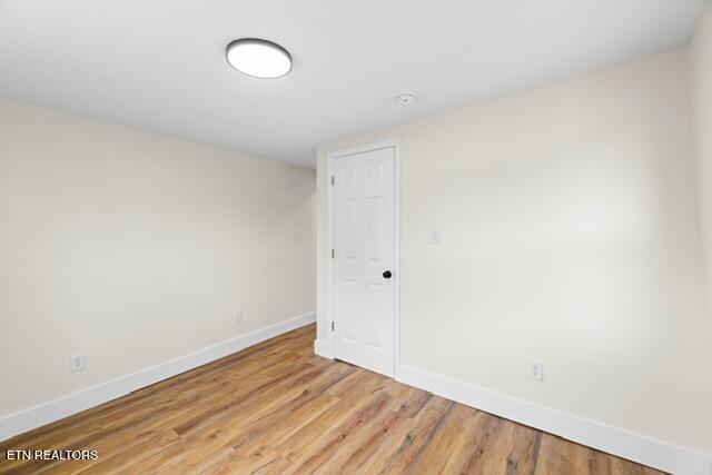 501 Dodson Ave, Englewood, TN 37329 - unfurnished room with baseboards and light wood-type flooring