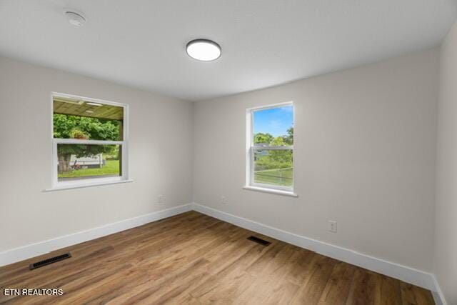 501 Dodson Ave, Englewood, TN 37329 - unfurnished room with baseboards and light wood-style floors
