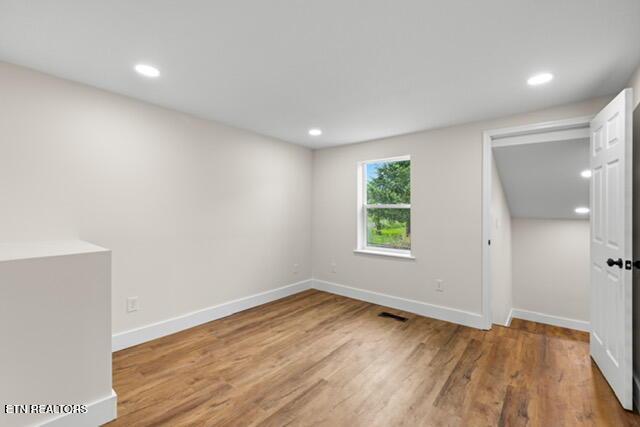 501 Dodson Ave, Englewood, TN 37329 - empty room with wood finished floors, baseboards, and recessed lighting