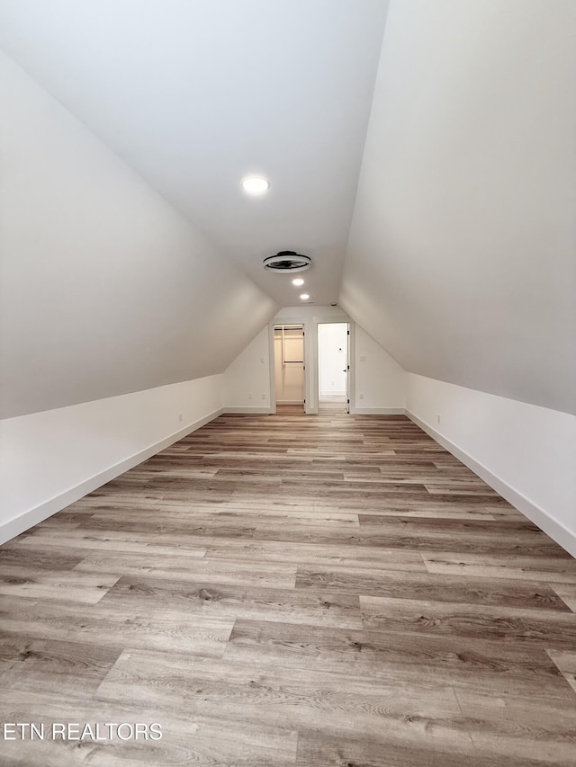8349 Cliff Ridge Ct, Corryton, TN 37721 - additional living space with lofted ceiling, baseboards, wood finished floors, and recessed lighting